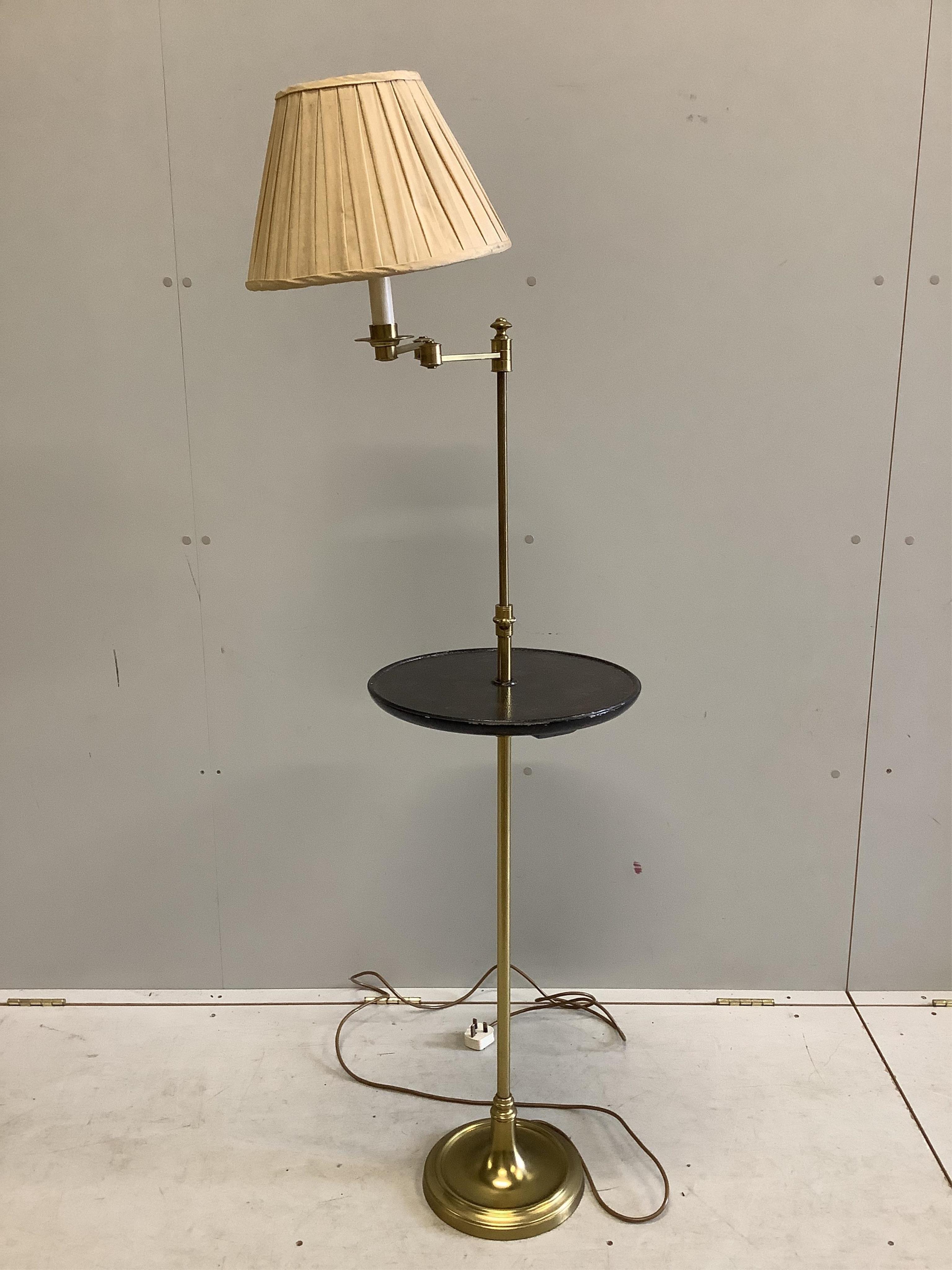 A telescopic standard lamp with a lacquered shelf, height 152cm. Condition - fair